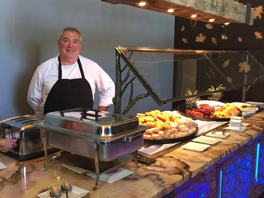 chef behind the cutting station