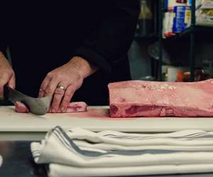 chef cutting meat